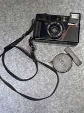 vintage Nikon L35AF 35mm with lens cover mechanicals tested