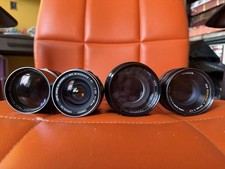 Lot of 4 Camera lenses, vintage cases, and a bunch of filters Minolta 35mm